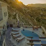 Отель Kayakapi Premium Caves Cappadocia